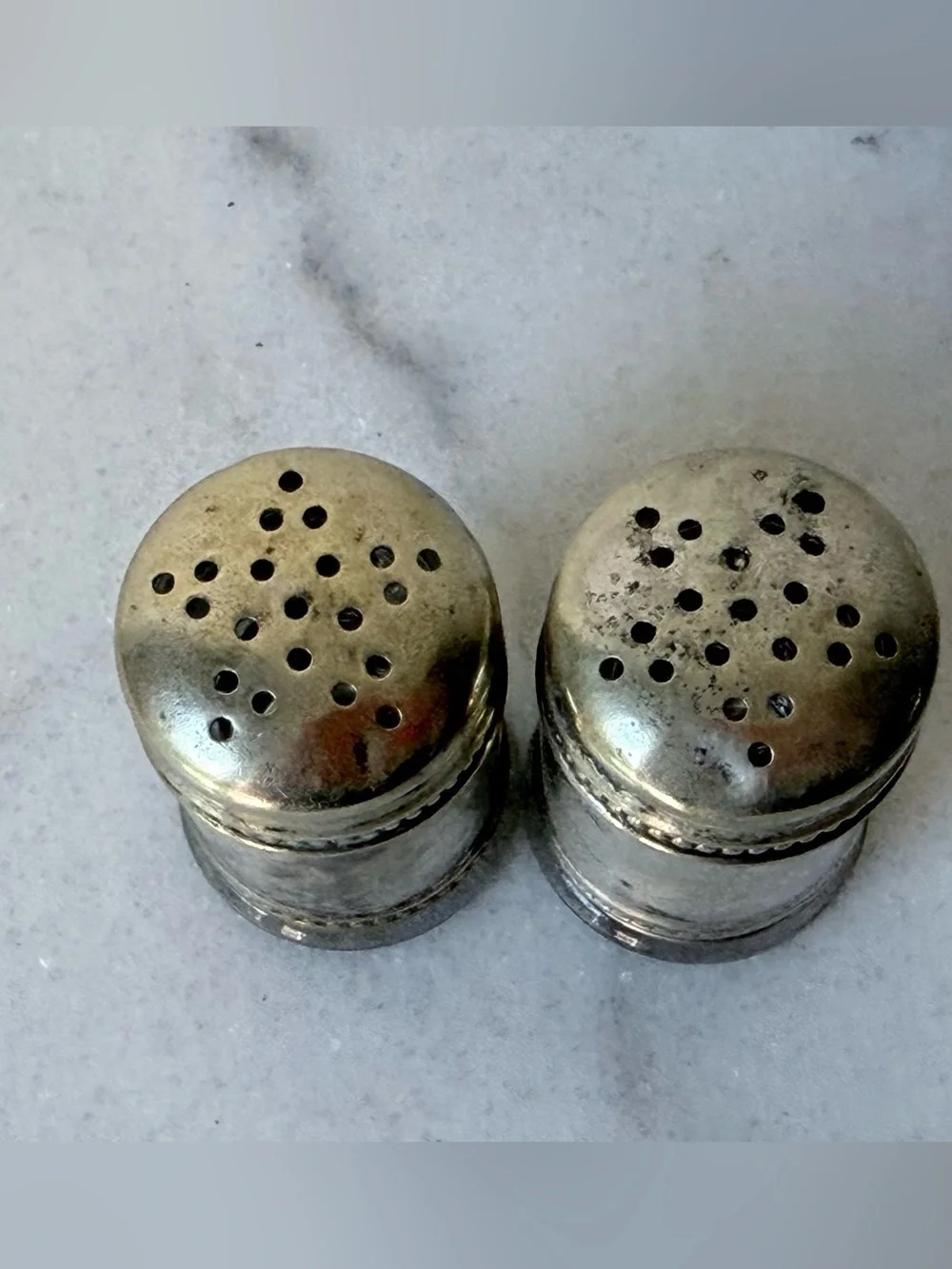 pair of antique EPNS silver salt and pepper shakers